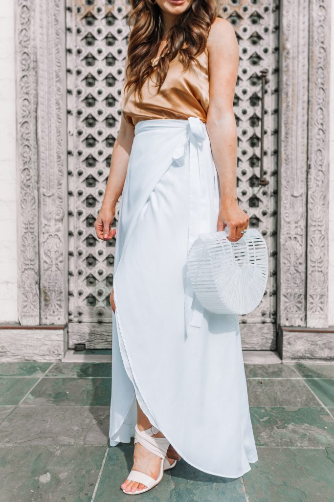 white maxi skirt and white acrylic arc bag