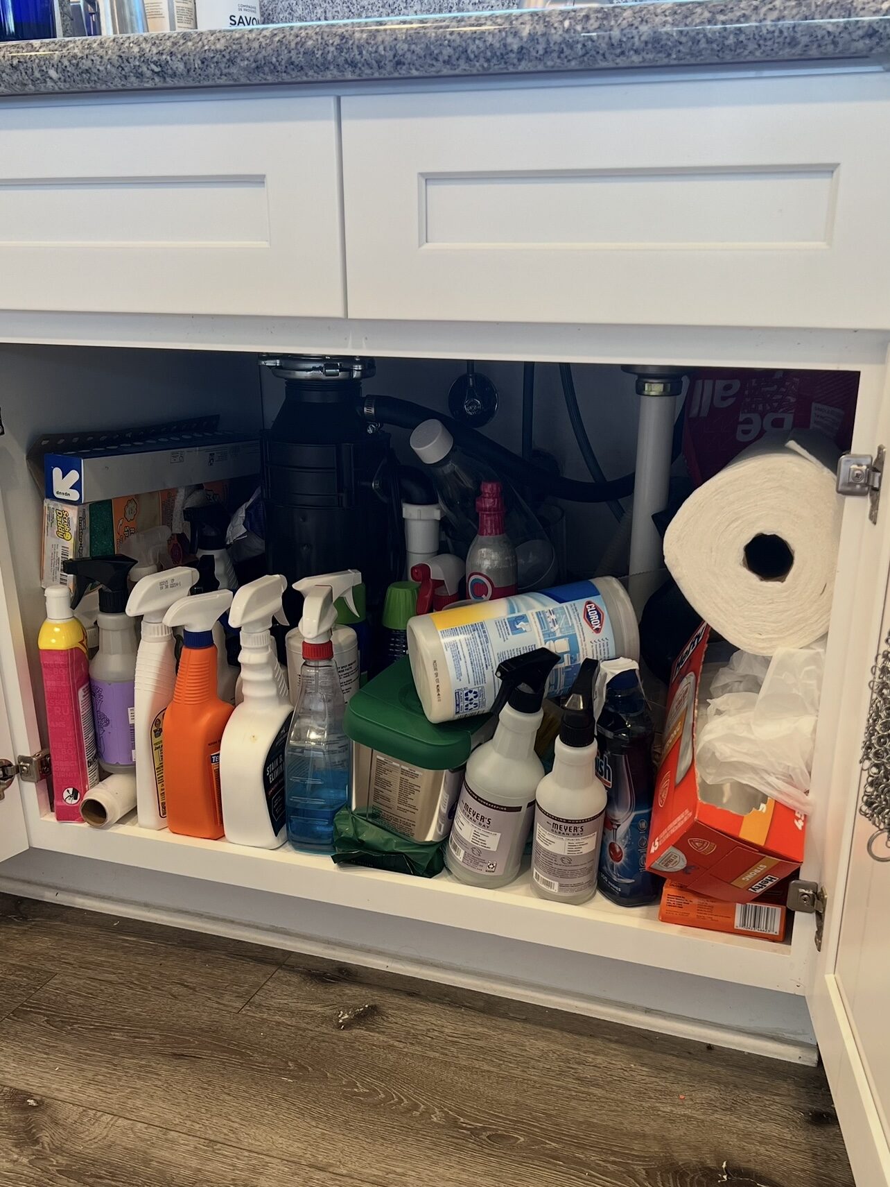 messy under the kitchen sink storage